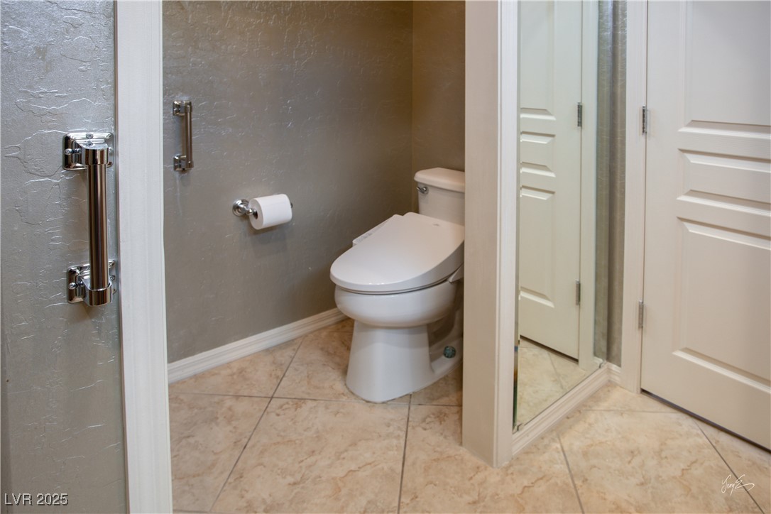 1074 Wagon Trail Mesquite, NV 89034 - Photo 15 of 27 Bathroom featuring tile patterned floors, toilet, and baseboards