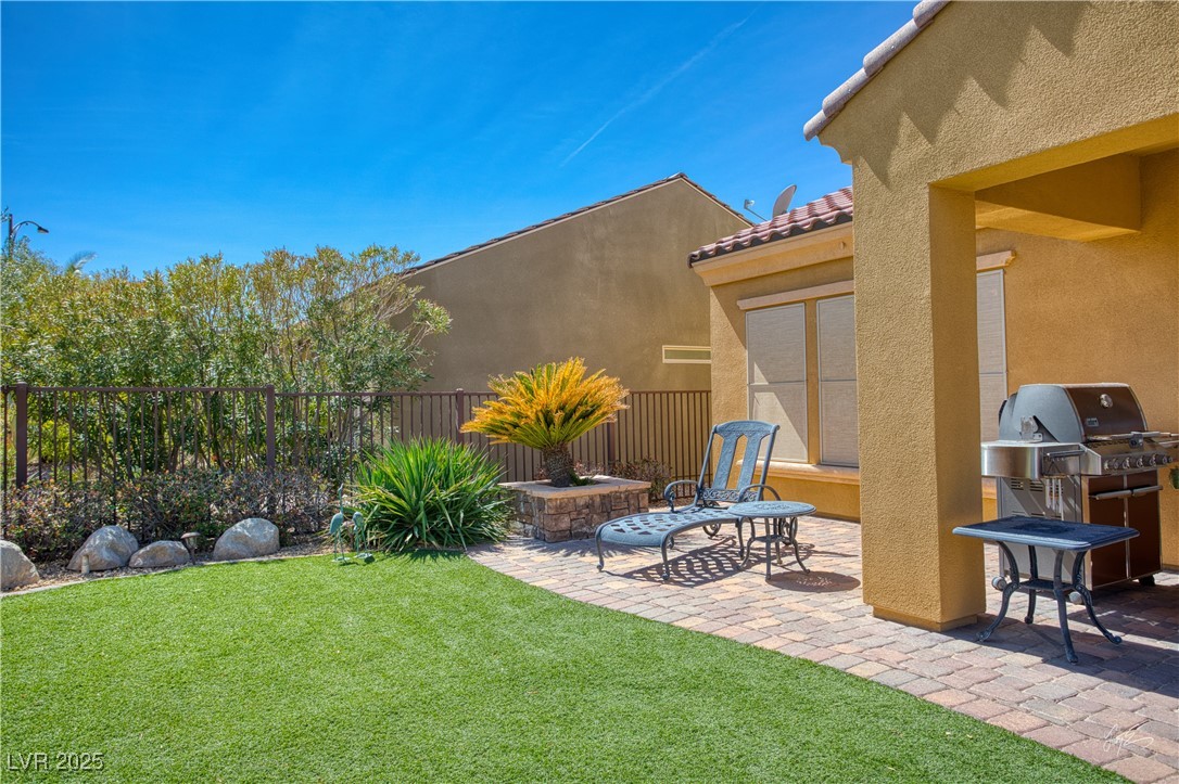 1074 Wagon Trail Mesquite, NV 89034 - Photo 23 of 27 View of yard featuring fence and a patio