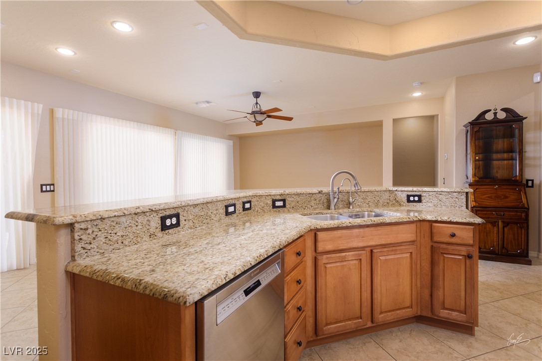 1074 Wagon Trail Mesquite, NV 89034 - Photo 8 of 27 Kitchen featuring ceiling fan, light stone countertops, recessed lighting, a sink, and stainless steel dishwasher