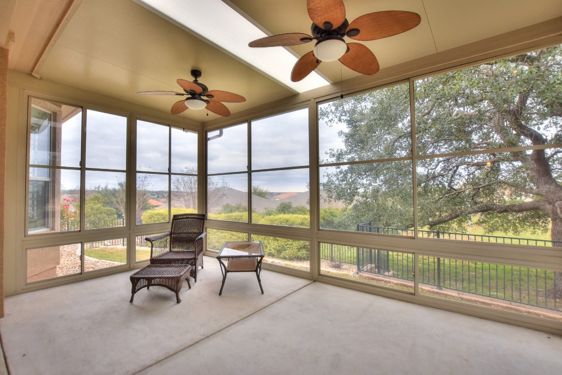 102 Ranger Peak Lane Georgetown, TX 78633 - Photo 1 of 1 a living room with furniture and a floor to ceiling window