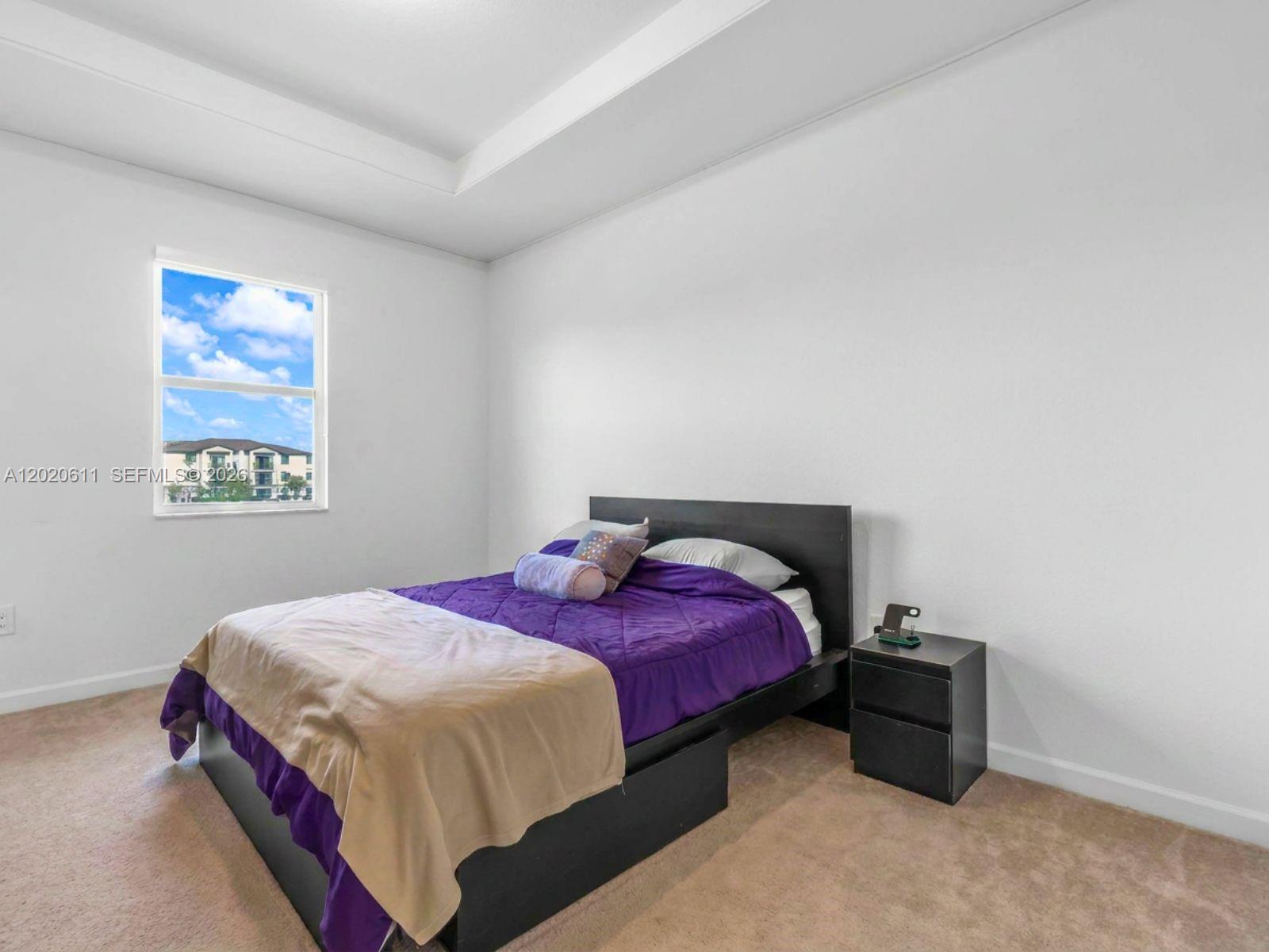 26455 Southwest 148th Avenue Homestead, FL 33032 - Photo 15 of 35 a bedroom with a bed and a window