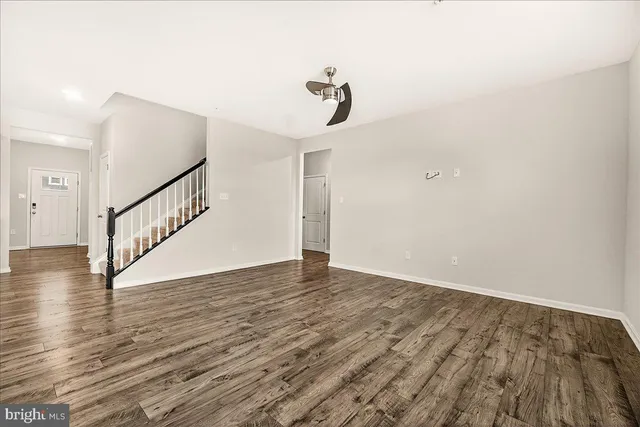 a view of an entryway with wooden floor