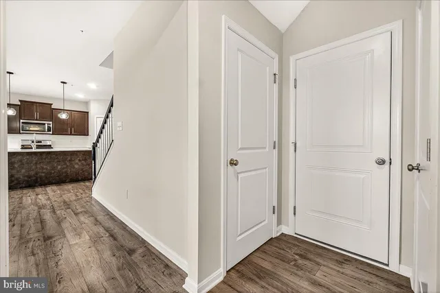 a view of a kitchen from the hallway