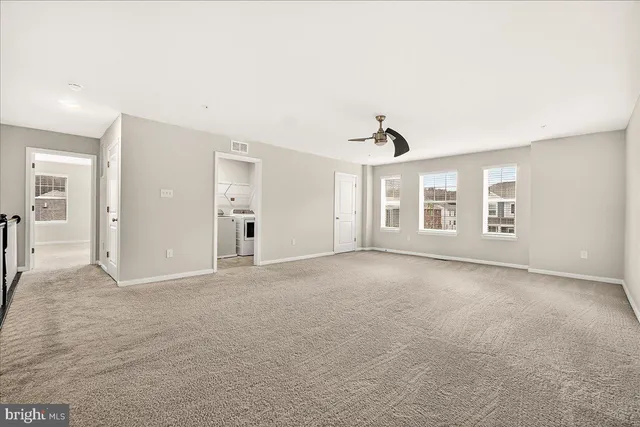 a view of empty room with windows