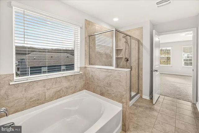 a bathroom with a sink double vanity and a mirror