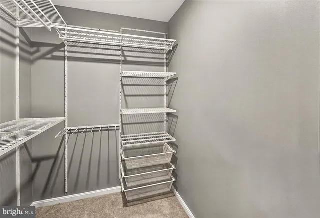 a white toilet sitting next to a bathroom