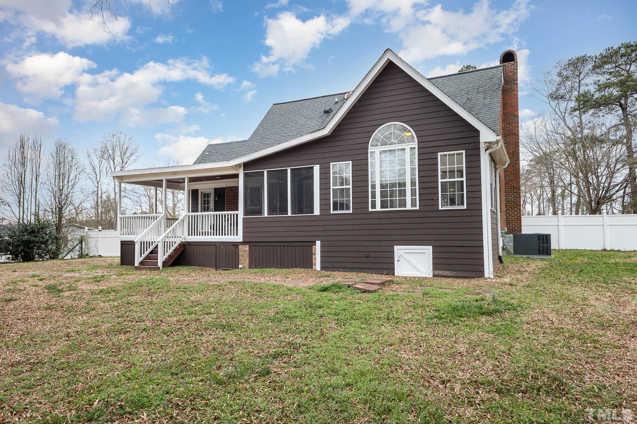 3404 Lizard Lick Road Wendell, NC 27591 - Photo 1 of 24 a front view of a house with garden