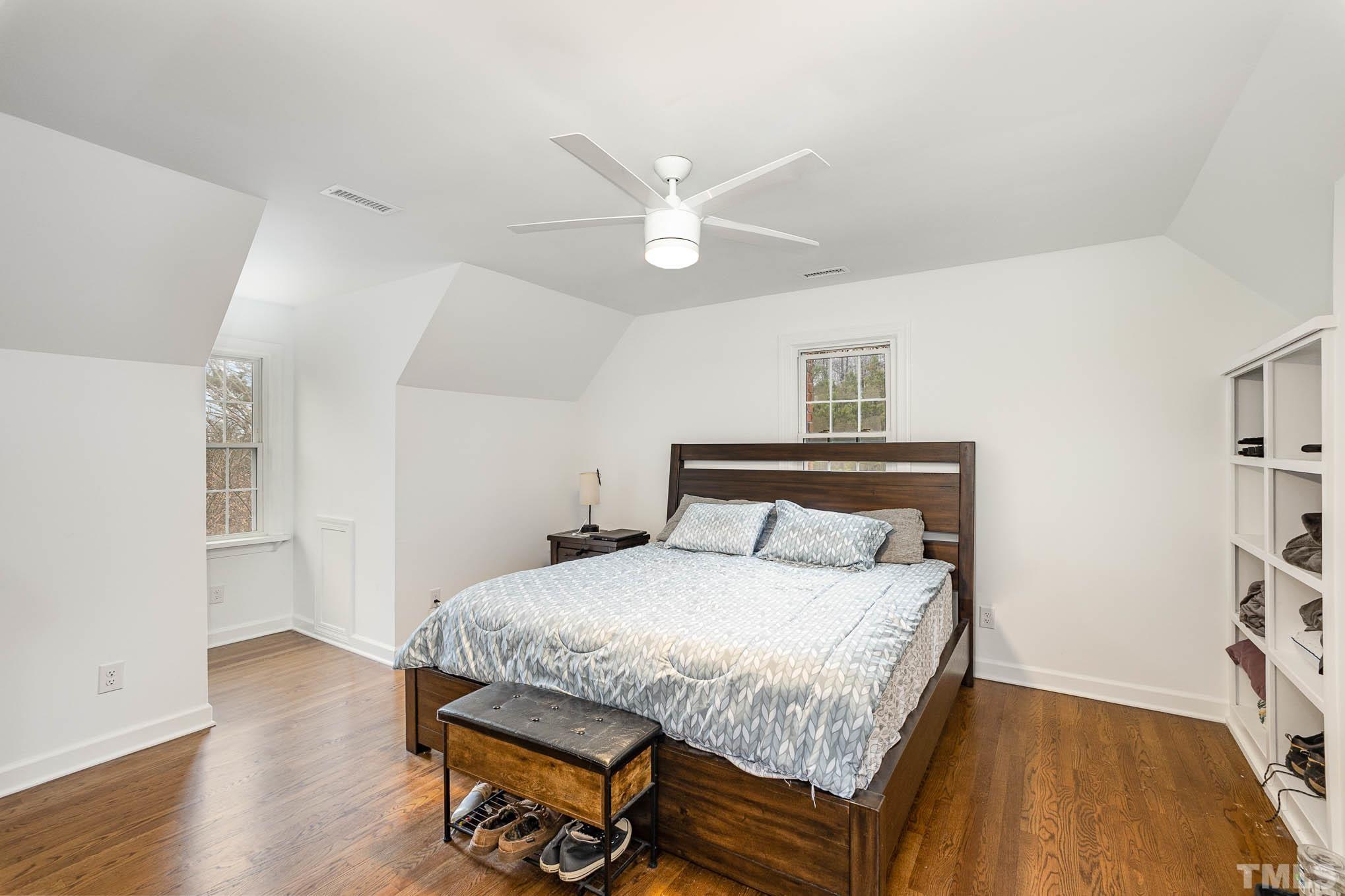 3404 Lizard Lick Road Wendell, NC 27591 - Photo 13 of 24 a bedroom with a bed and wooden floor