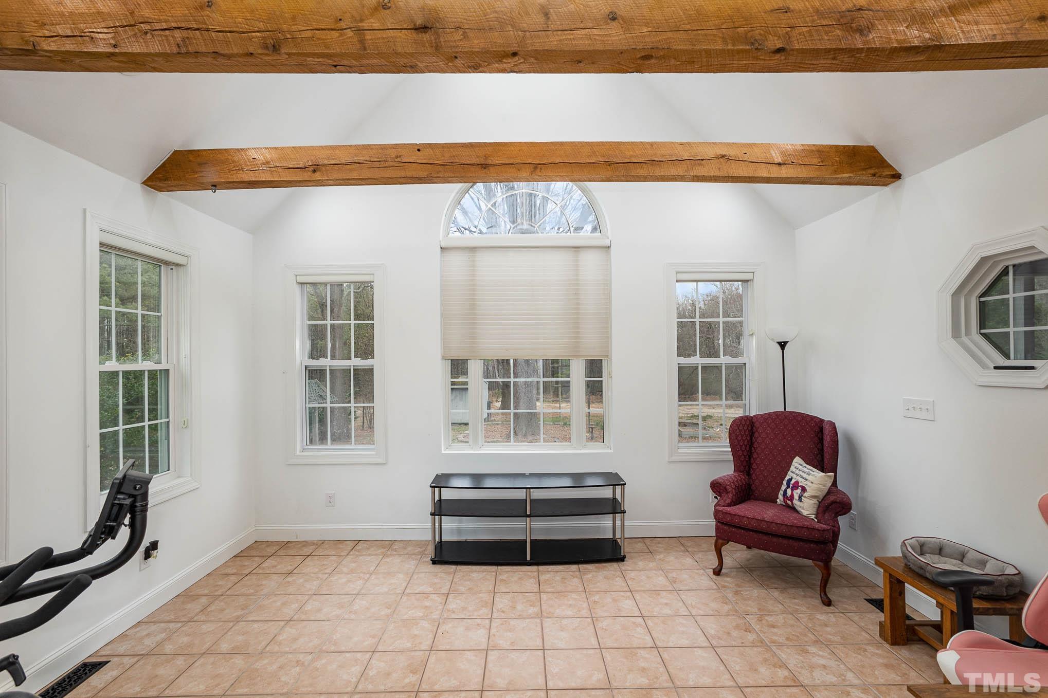 3404 Lizard Lick Road Wendell, NC 27591 - Photo 17 of 24 a bedroom with furniture and a window