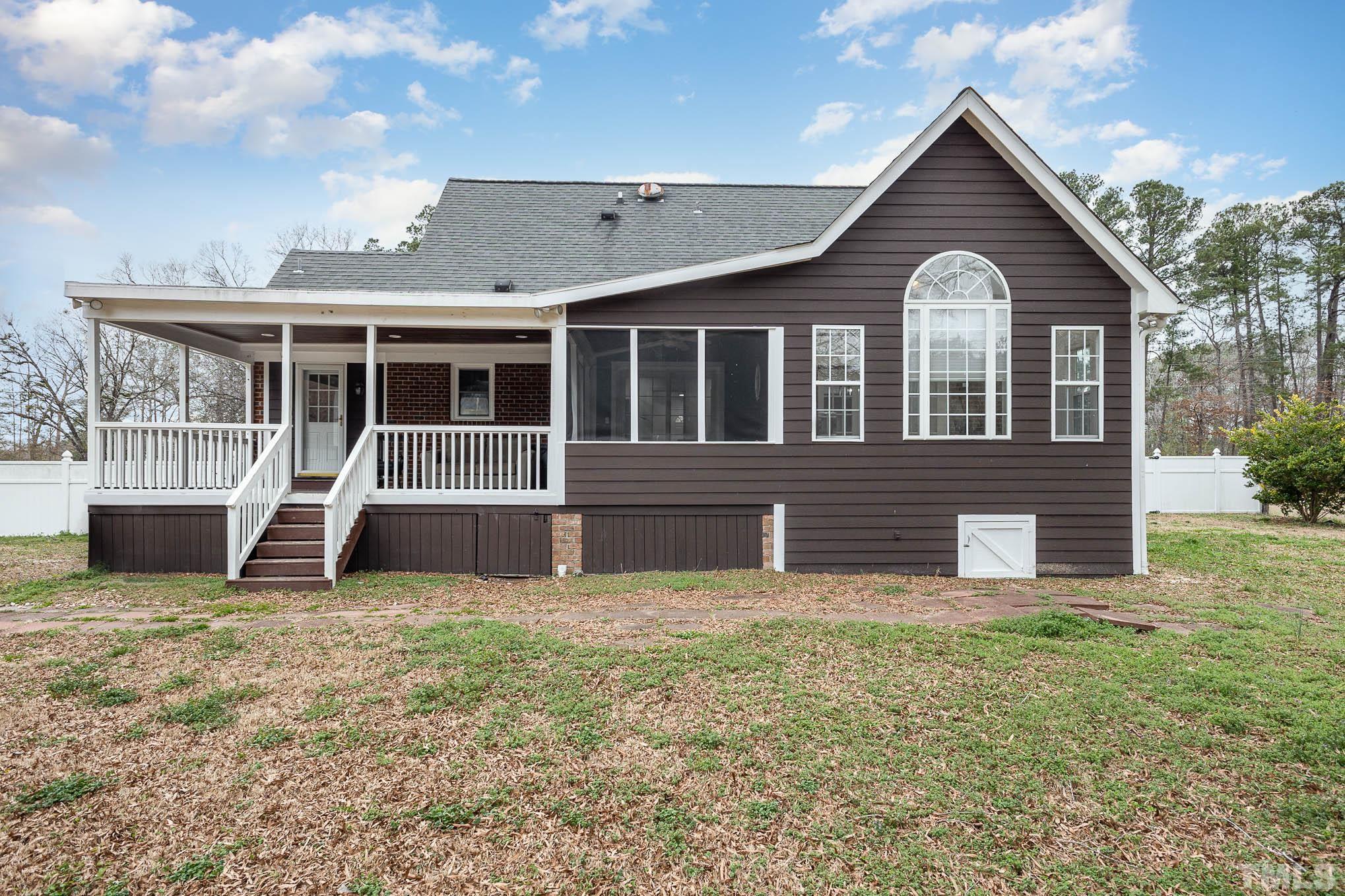 3404 Lizard Lick Road Wendell, NC 27591 - Photo 21 of 24 a front view of a house with a yard