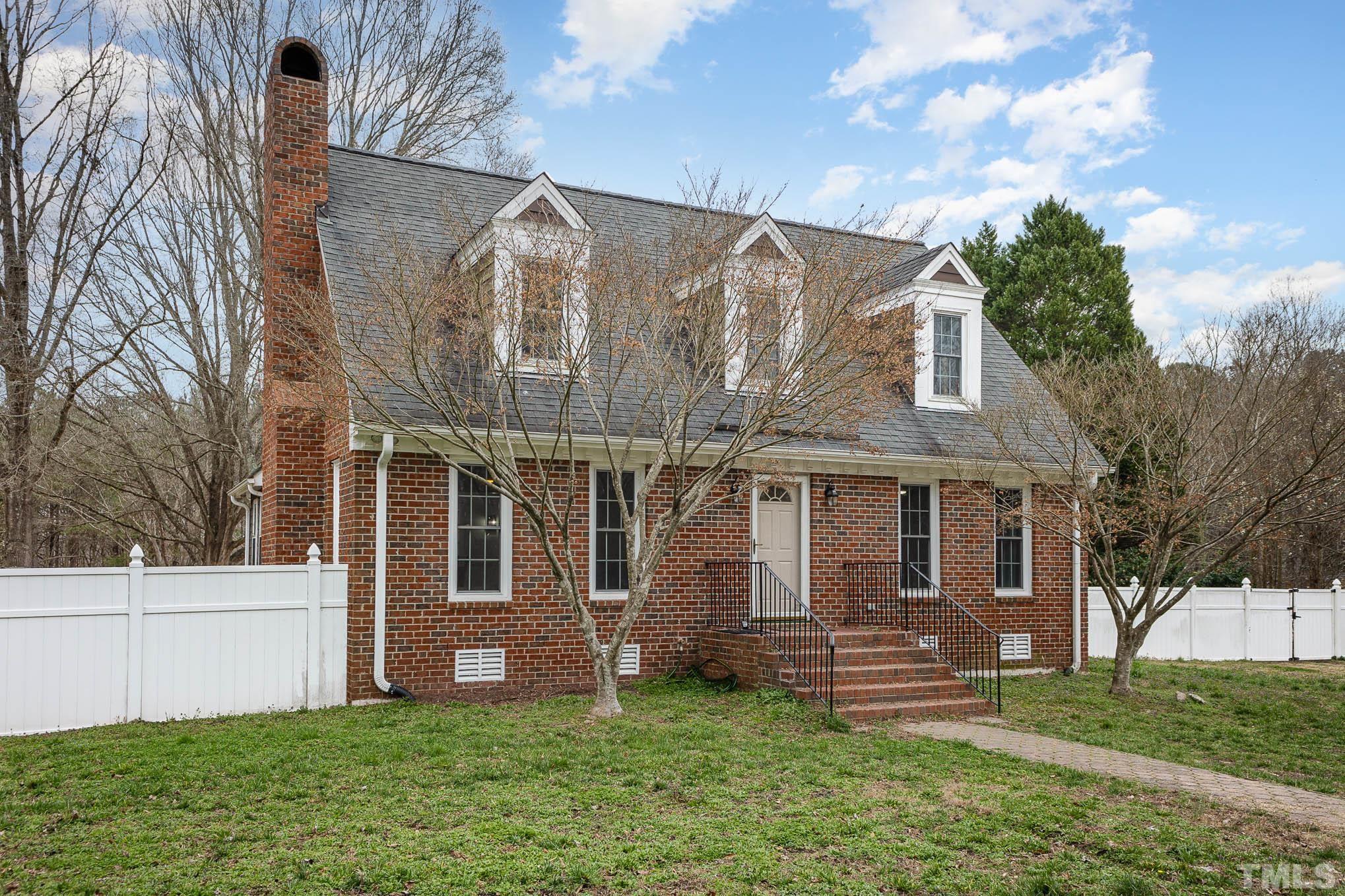 3404 Lizard Lick Road Wendell, NC 27591 - Photo 3 of 24 a front view of a house with a yard