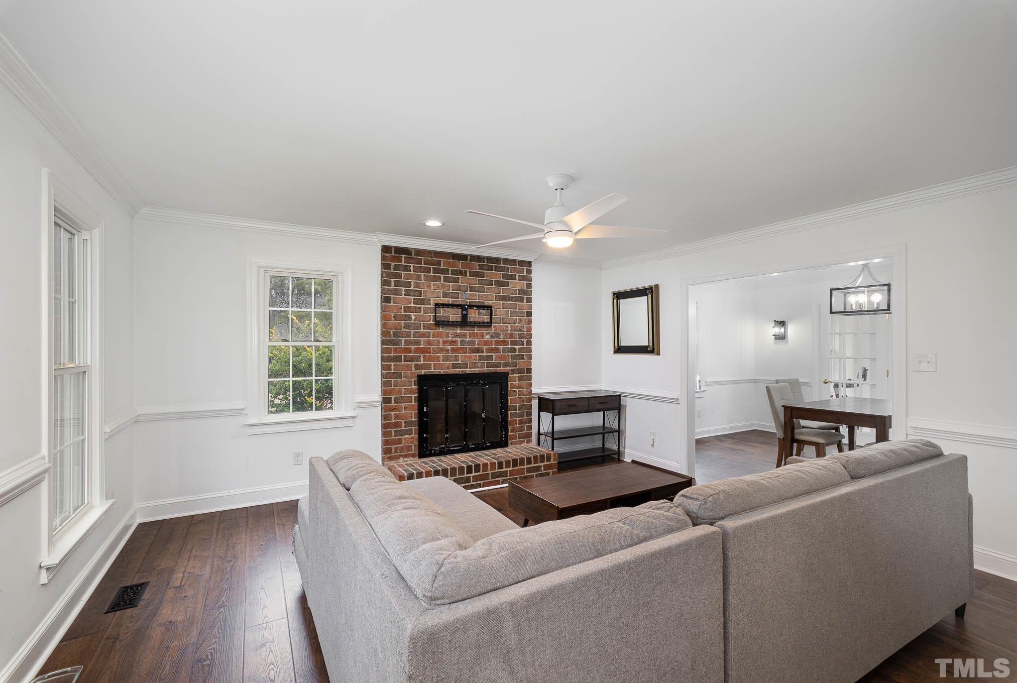 3404 Lizard Lick Road Wendell, NC 27591 - Photo 6 of 24 a living room with furniture and a fireplace