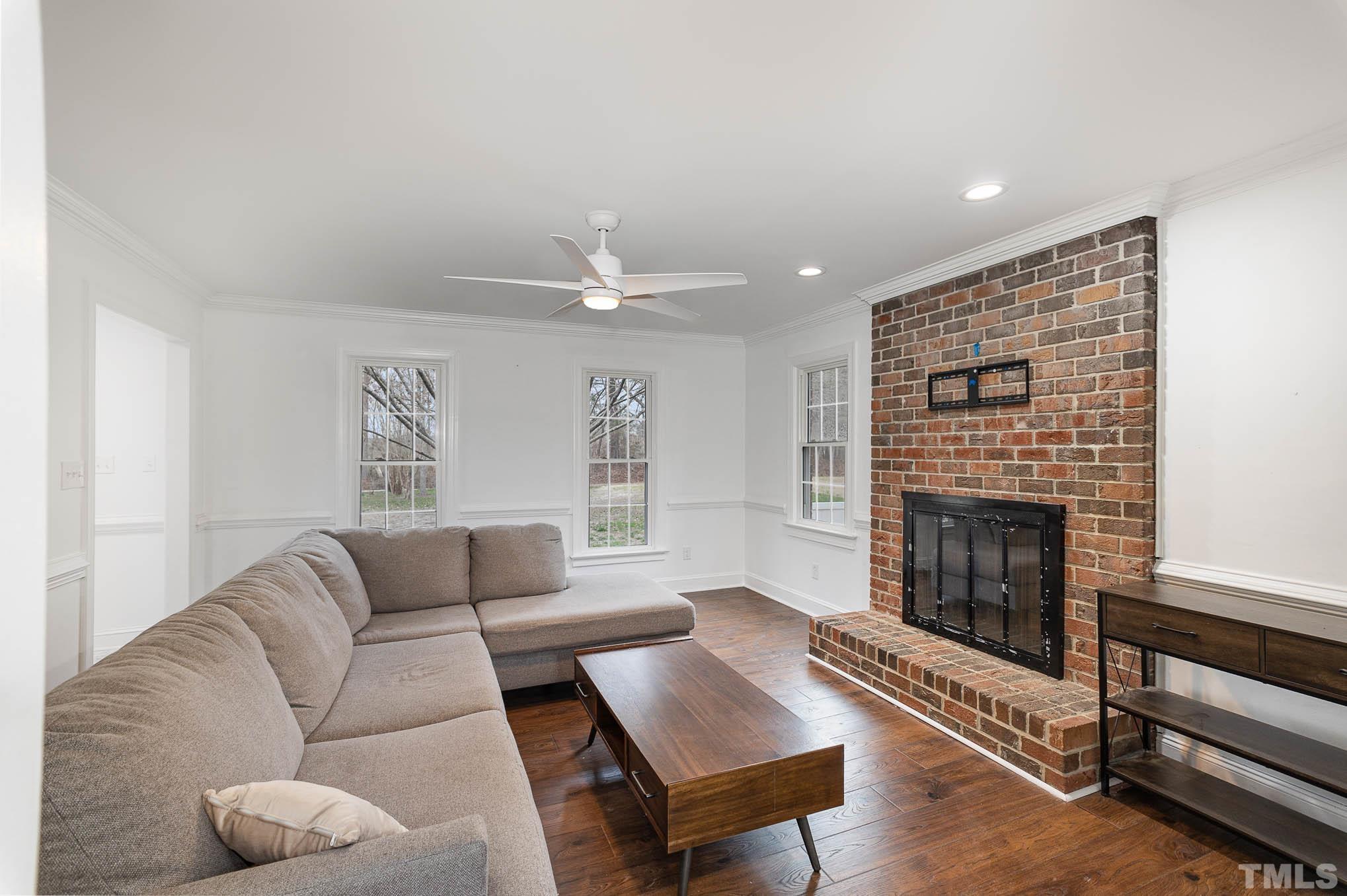 3404 Lizard Lick Road Wendell, NC 27591 - Photo 7 of 24 a living room with furniture and a fireplace