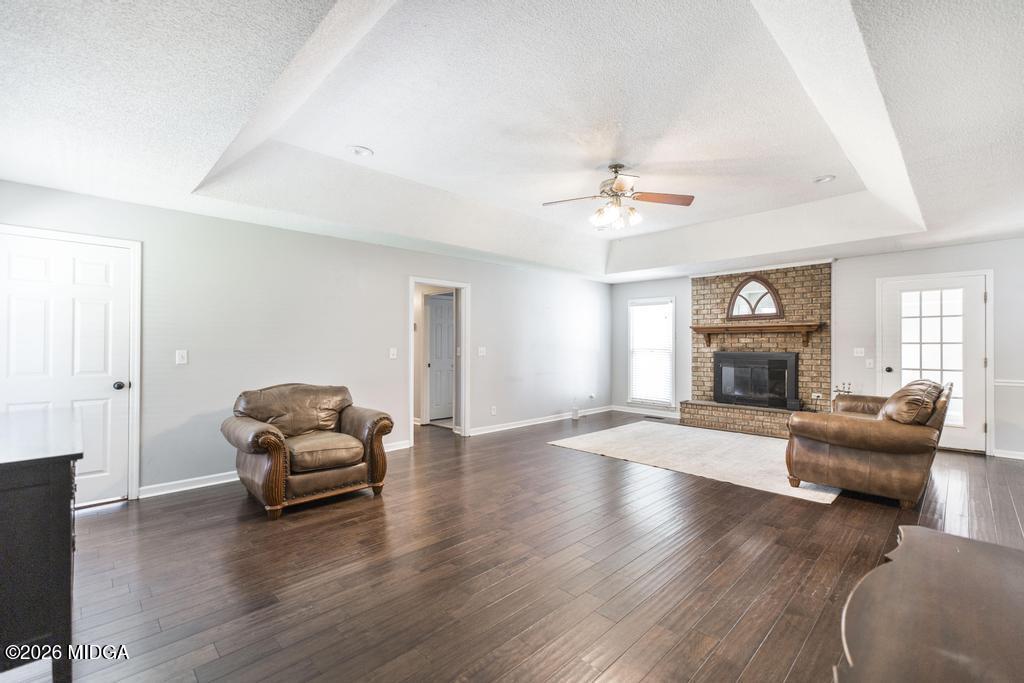3710 Sandy Circle Macon, GA 31216 - Photo 9 of 44 a living room with furniture and a fireplace