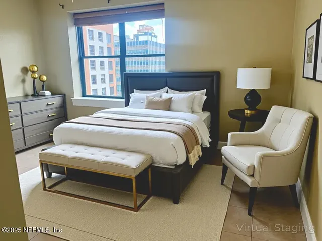 a bedroom with a bed and a window