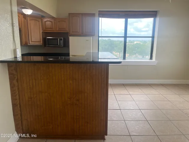 a bathroom with a sink a vanity and a window