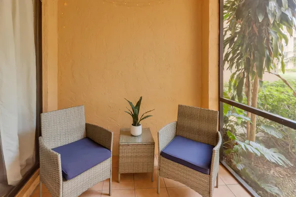 a view of sitting area with furniture and a potted plant