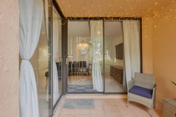 a view of a glass door and the porch