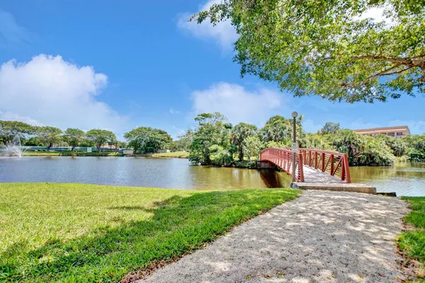 a view of a lake with a house in the background