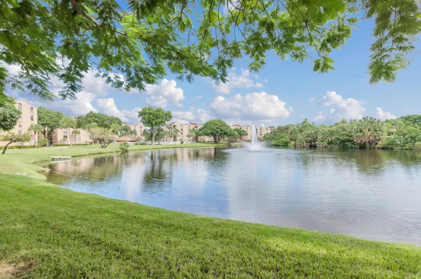a view of a lake with houses in the background