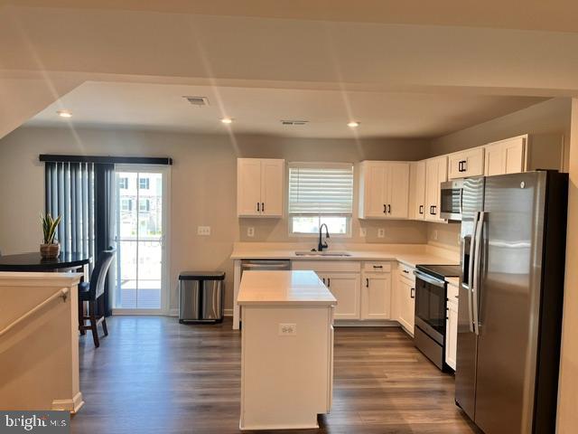 7236 Potomac Terrace Ruther Glen, VA 22546 - Photo 6 of 24 a kitchen with stainless steel appliances granite countertop a refrigerator a stove top oven a sink dishwasher and wooden cabinets