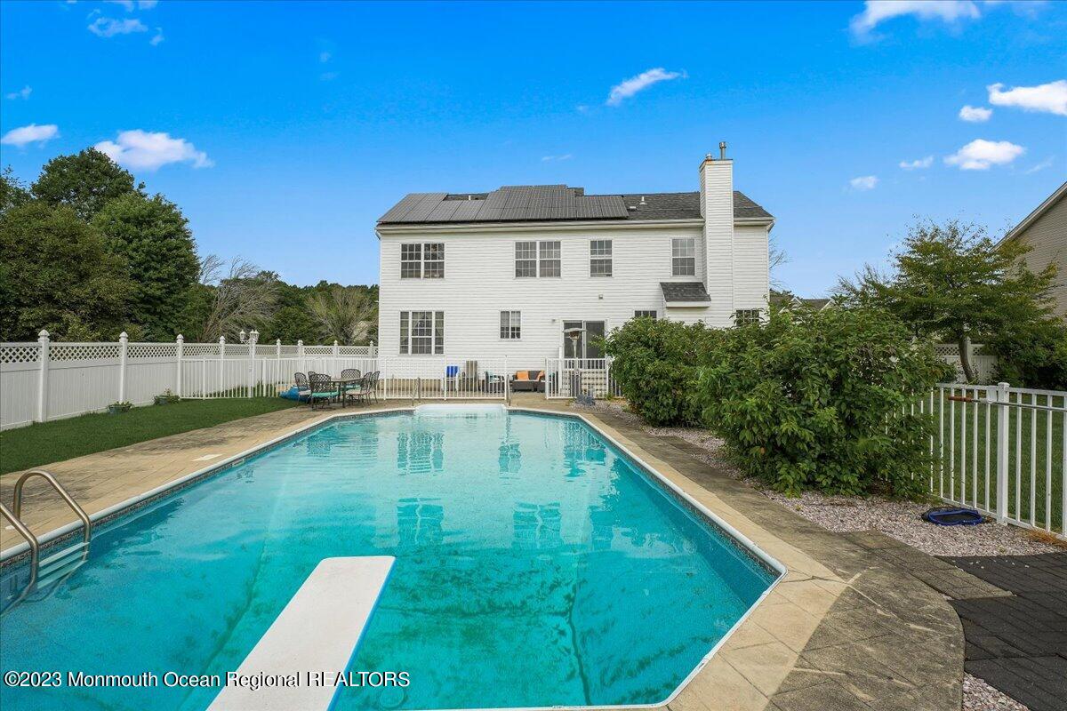 1 Chiswick Drive Jackson, NJ 08527 - Photo 36 of 48 a view of a backyard with swimming pool