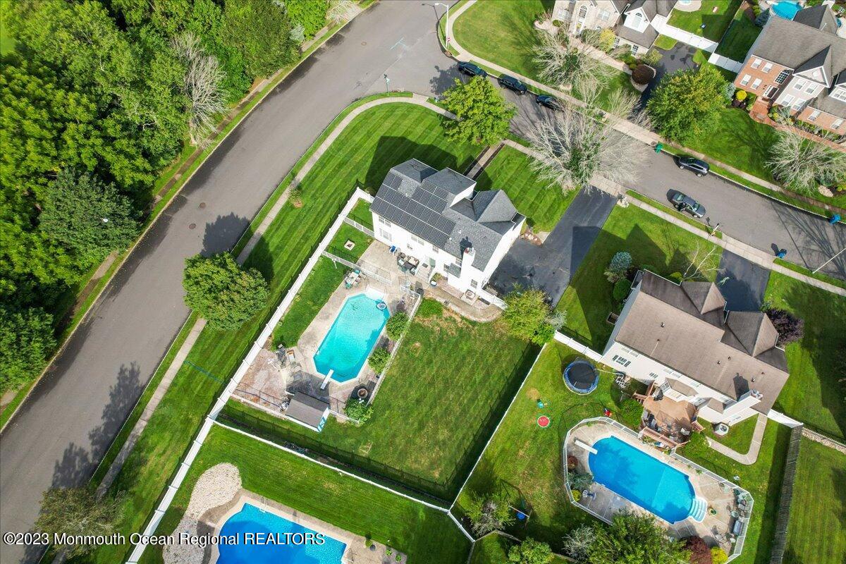 1 Chiswick Drive Jackson, NJ 08527 - Photo 45 of 48 an aerial view of a tennis ground with a swimming pool