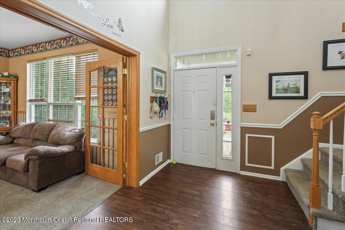 1 Chiswick Drive Jackson, NJ 08527 - Photo 5 of 48 a living room with furniture and wooden floor