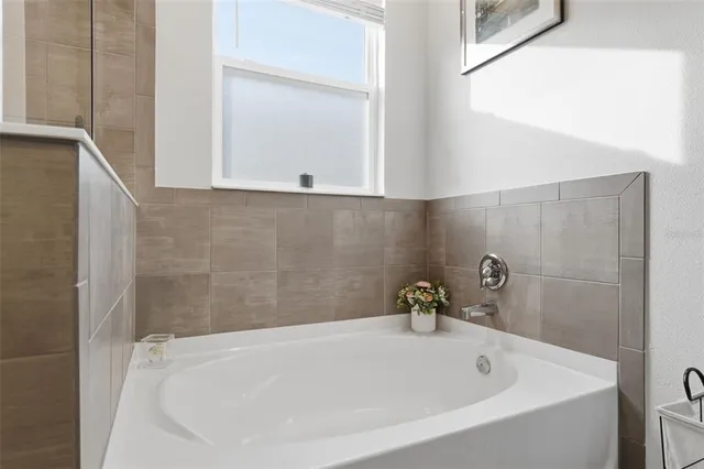 a white bath tub sitting in a bathroom