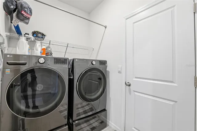 a utility room with dryer and washer