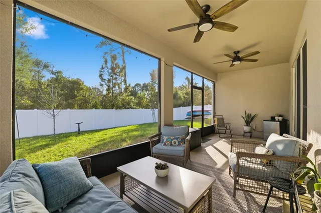 a living room with patio furniture
