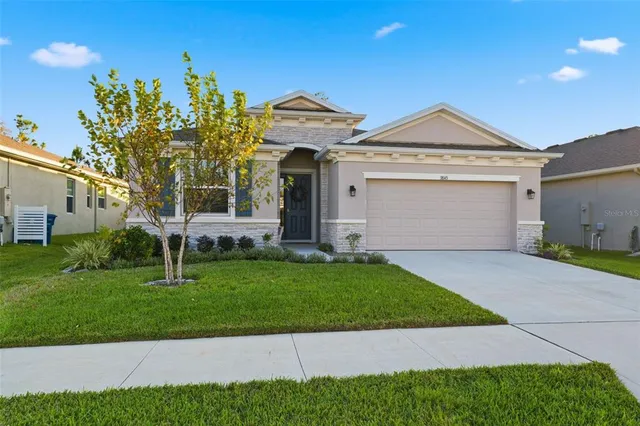 a work room with furniture and wooden floor