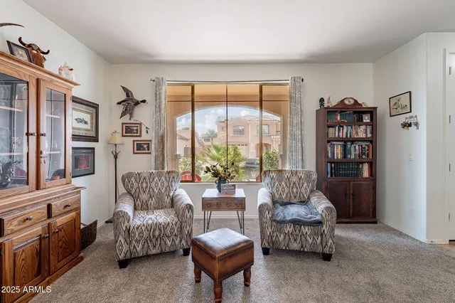a living room with furniture and a large window