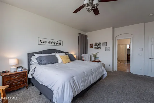 a bedroom with bed and window