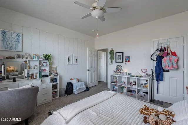 a bedroom with furniture and a chandelier