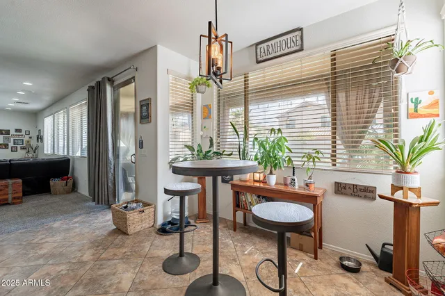 a view of a livingroom with furniture and a window