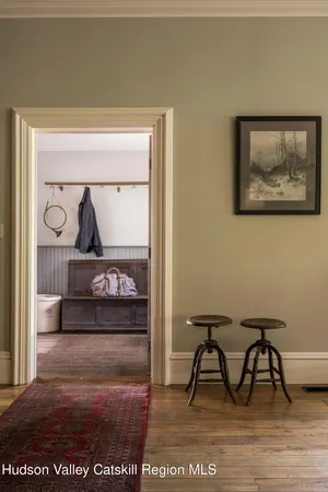 a dining room with furniture and window