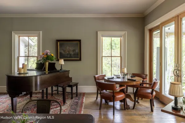 a view of a dining room with furniture window and wooden floor