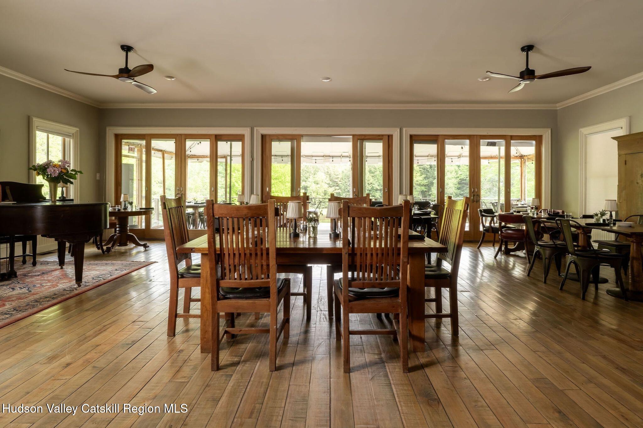 102 Main Street Jefferson, NY 12093 - Photo 15 of 57 a view of a dining room with furniture window and wooden floor