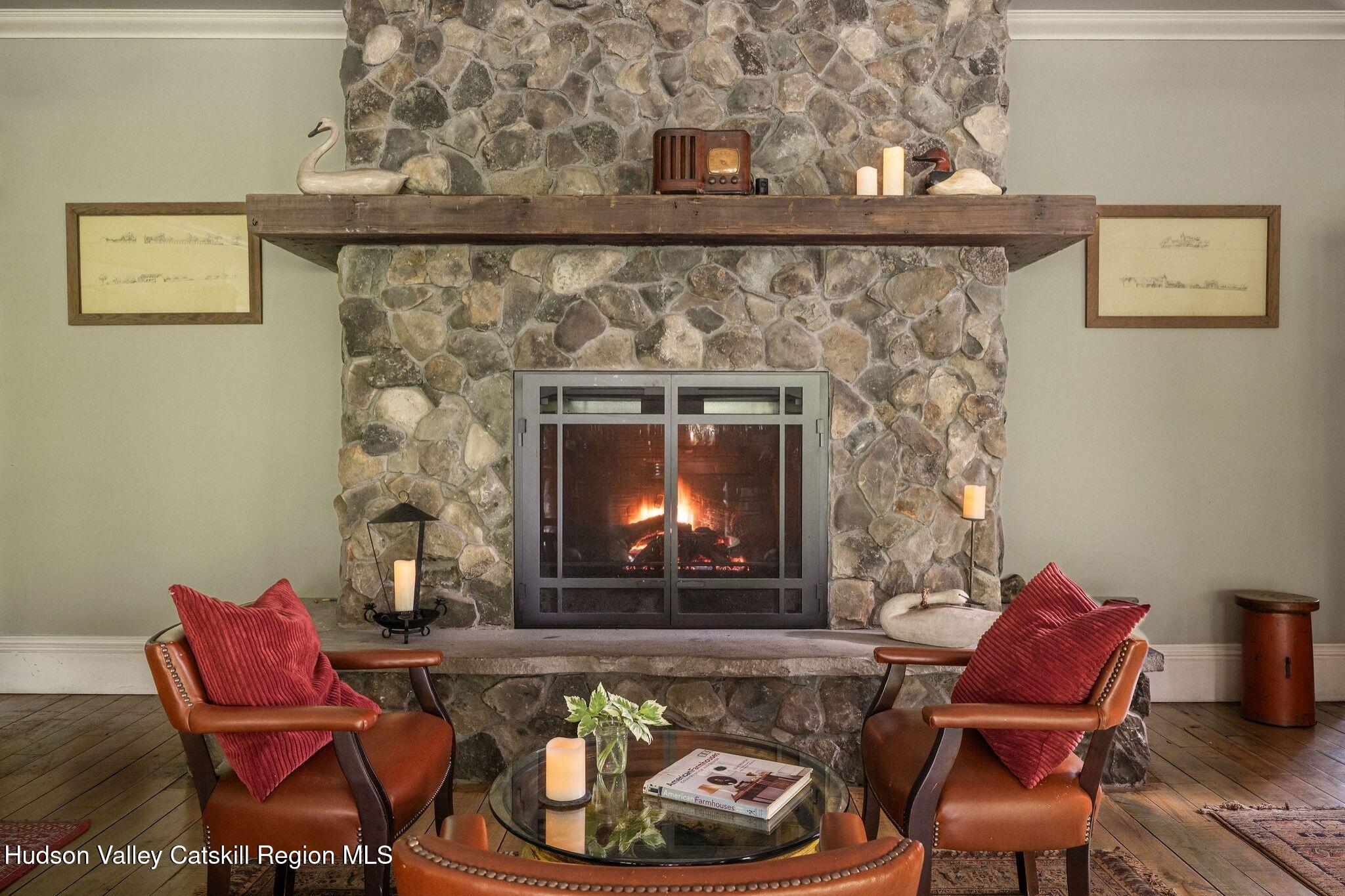 102 Main Street Jefferson, NY 12093 - Photo 16 of 57 a living room with furniture and a fireplace
