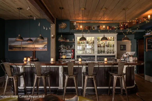 a room with furniture a rug and a window