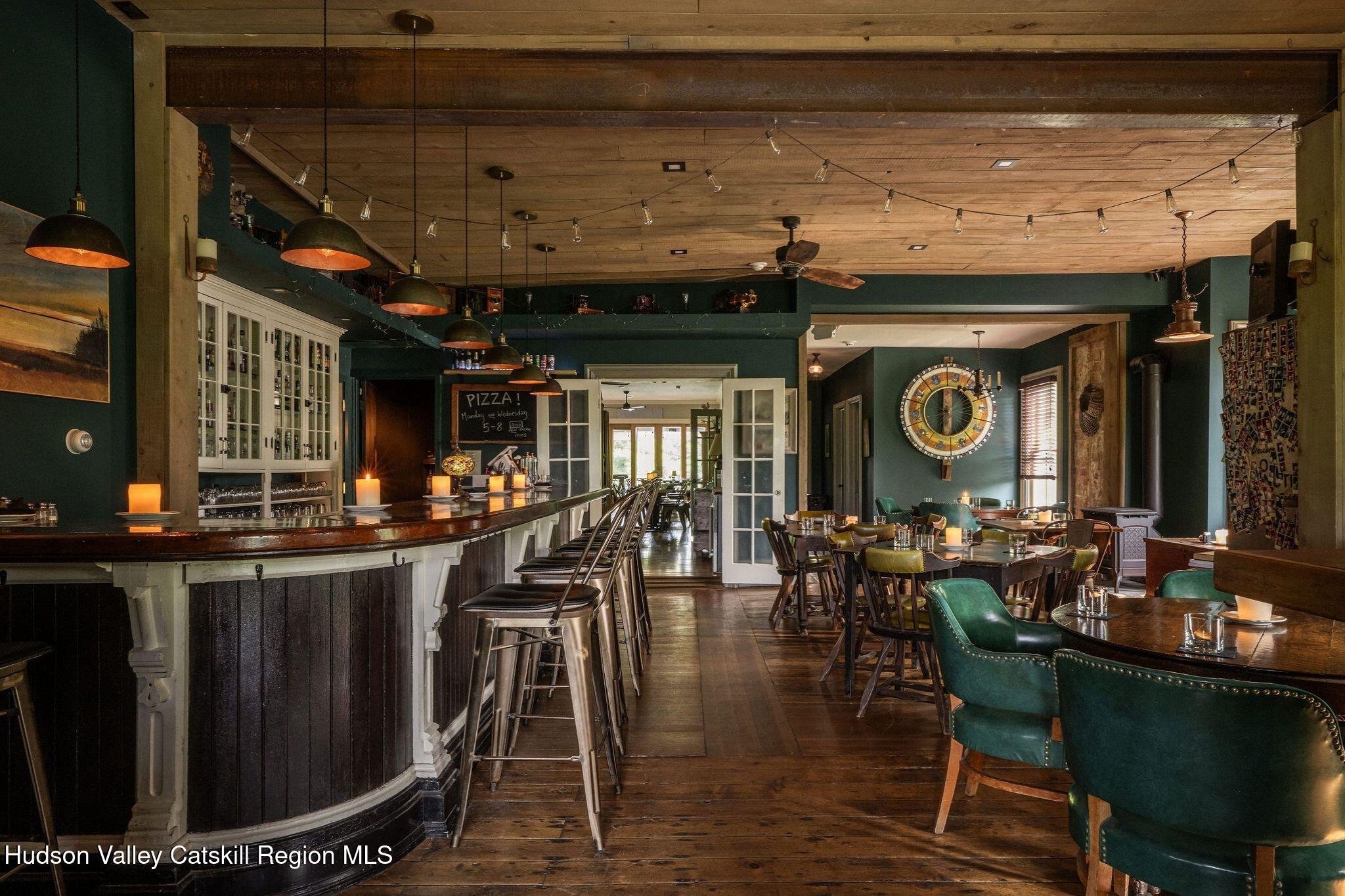 102 Main Street Jefferson, NY 12093 - Photo 24 of 57 a group of people sitting in a room