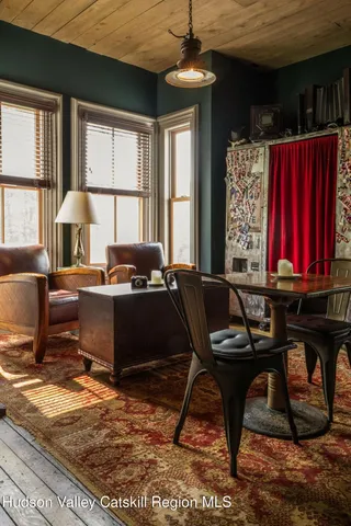 a view of a house with backyard space and sitting area