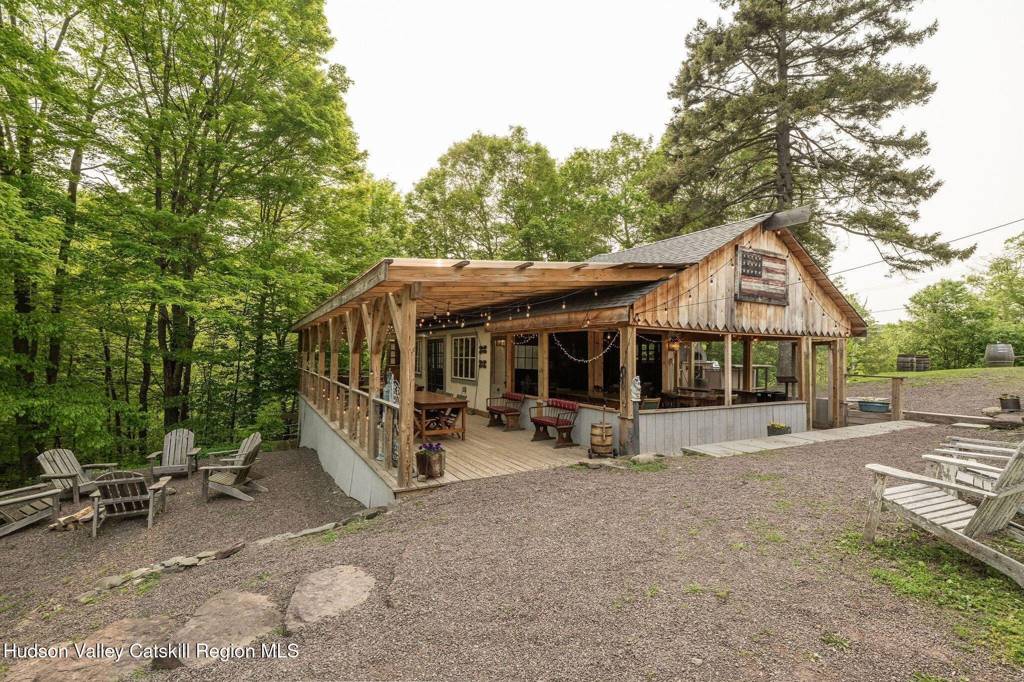 102 Main Street Jefferson, NY 12093 - Photo 29 of 57 a view of a house with backyard space and sitting area