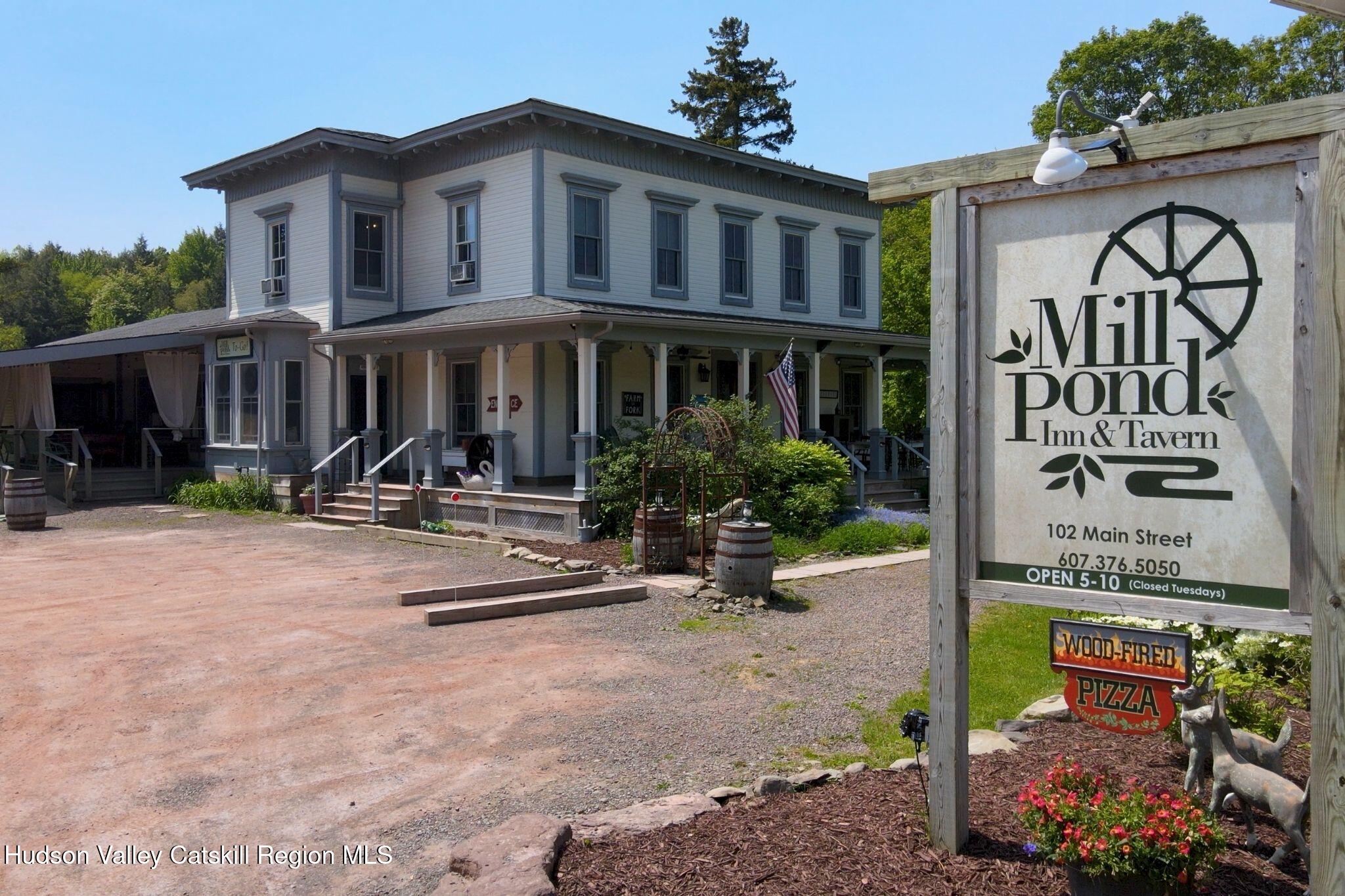 102 Main Street Jefferson, NY 12093 - Photo 3 of 57 a front view of a house with porch and sitting area