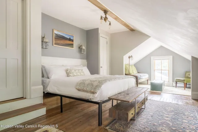 a view of a living room filled with furniture