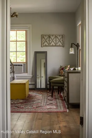 a room with a window and a chair