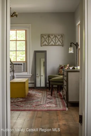 a room with a window and a chair