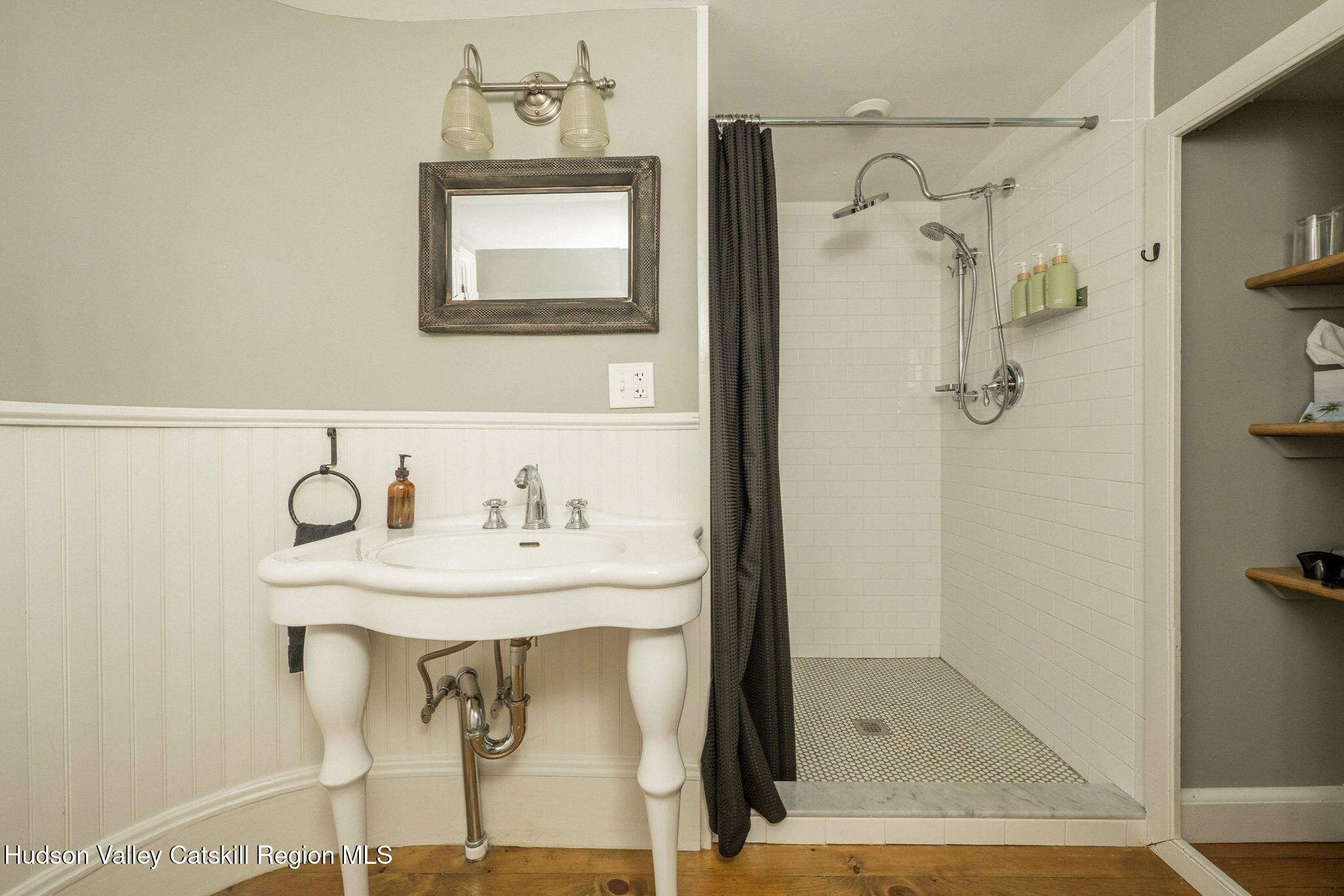 102 Main Street Jefferson, NY 12093 - Photo 48 of 57 a bathroom with a sink and a mirror