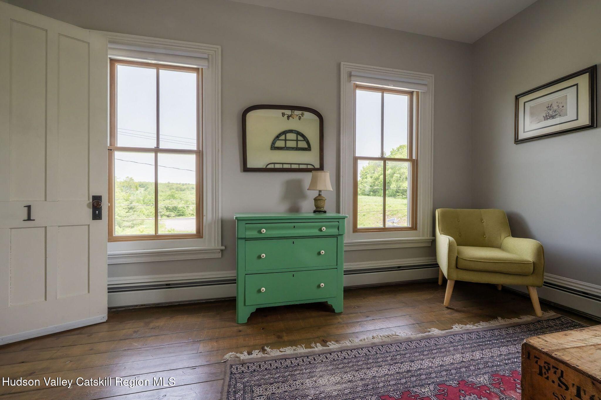 102 Main Street Jefferson, NY 12093 - Photo 52 of 57 a room with a window and a chair